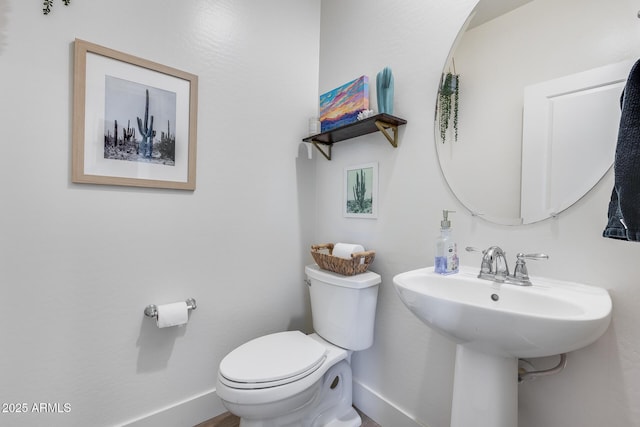 bathroom featuring sink and toilet