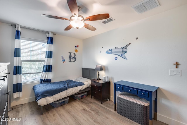 bedroom featuring light hardwood / wood-style flooring and ceiling fan