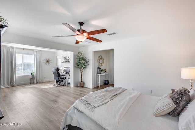 bedroom with light hardwood / wood-style flooring and ceiling fan