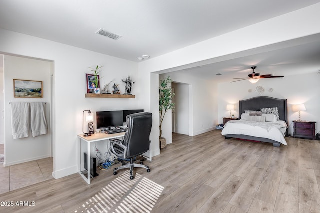 bedroom with ceiling fan and light hardwood / wood-style floors