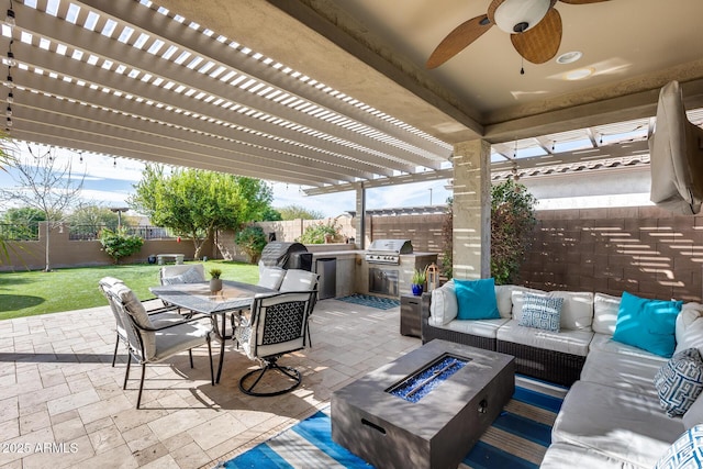 view of patio with an outdoor kitchen, an outdoor living space with a fire pit, grilling area, and a pergola