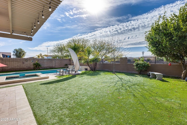 view of yard with a fenced in pool