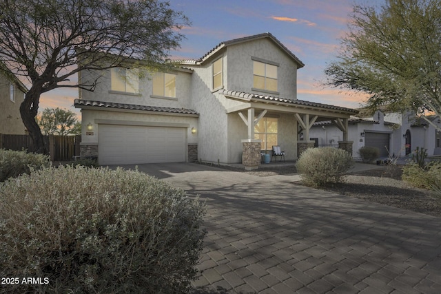 view of front of house with a porch and a garage