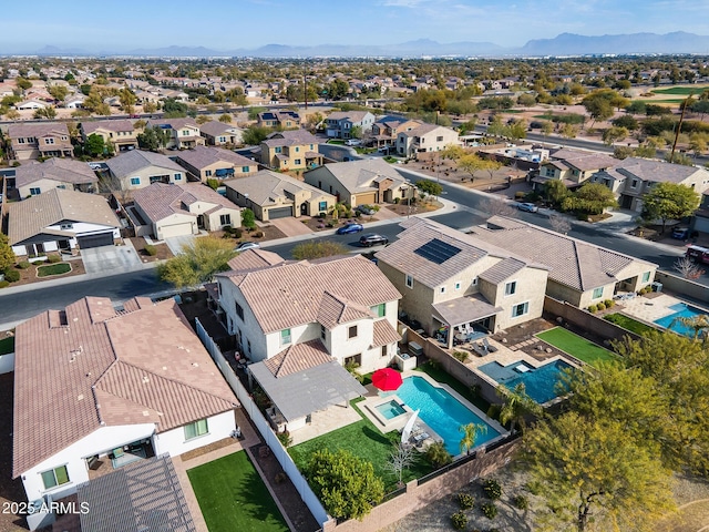 birds eye view of property featuring a mountain view