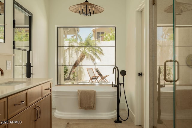 interior space featuring light tile patterned flooring, a sink, and a wealth of natural light