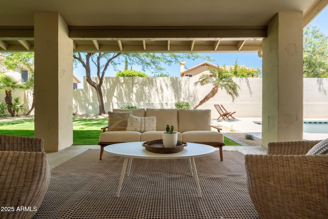 view of patio with outdoor lounge area, a fenced backyard, and a fenced in pool