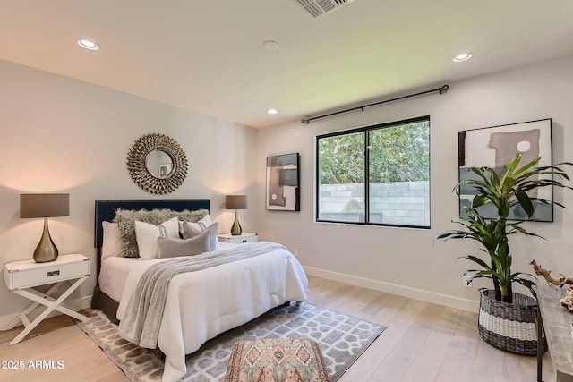 bedroom with recessed lighting, baseboards, light wood finished floors, and visible vents