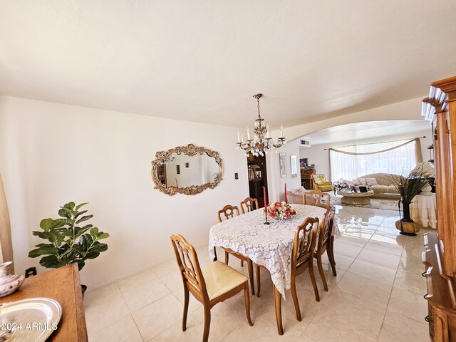 2201 E 7th St, Douglas, AZ 85607 - dining area with arched walkways, light tile patterned floors, and a chandelier