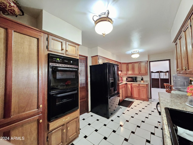 2201 E 7th St, Douglas, AZ 85607 - kitchen with black appliances, light flooring, light countertops, and brown cabinets
