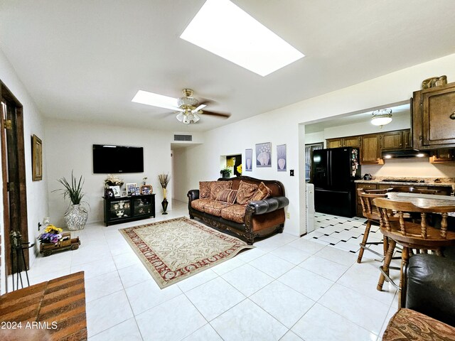 2201 E 7th St, Douglas, AZ 85607 - living area featuring a skylight, light tile patterned floors, and ceiling fan