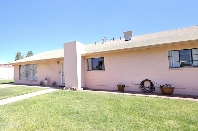 2201 E 7th St, Douglas, AZ 85607 - back of property with a yard and brick siding