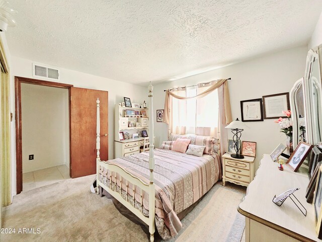 2201 E 7th St, Douglas, AZ 85607 - bedroom with a textured ceiling and light colored carpet