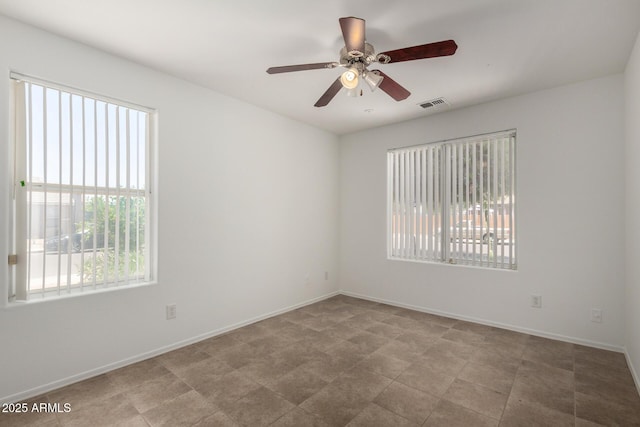 6515 W Hughes Dr, Phoenix, AZ 85043 - spare room featuring ceiling fan and baseboards