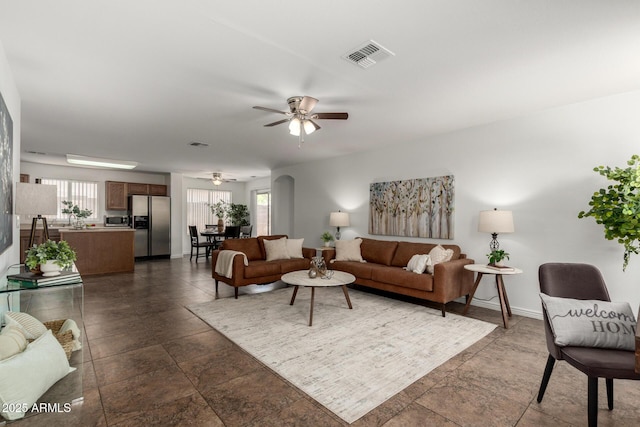 6515 W Hughes Dr, Phoenix, AZ 85043 - living room with a ceiling fan and dark stone finish floors