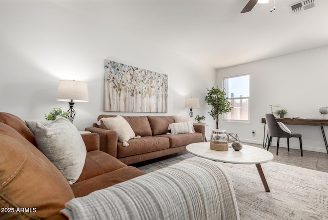 6515 W Hughes Dr, Phoenix, AZ 85043 - tiled living area featuring a ceiling fan and baseboards