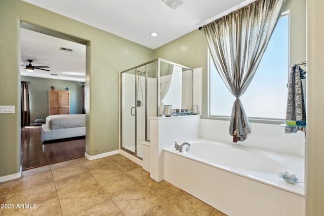 ensuite bathroom featuring visible vents, connected bathroom, a garden tub, and a shower stall