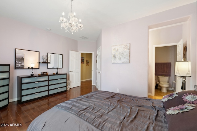 bedroom with baseboards, a chandelier, wood finished floors, and visible vents