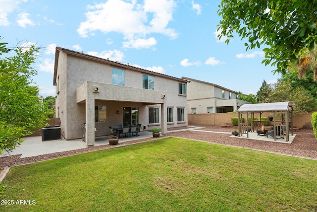 rear view of house with cooling unit, a patio, a fenced backyard, stucco siding, and a lawn