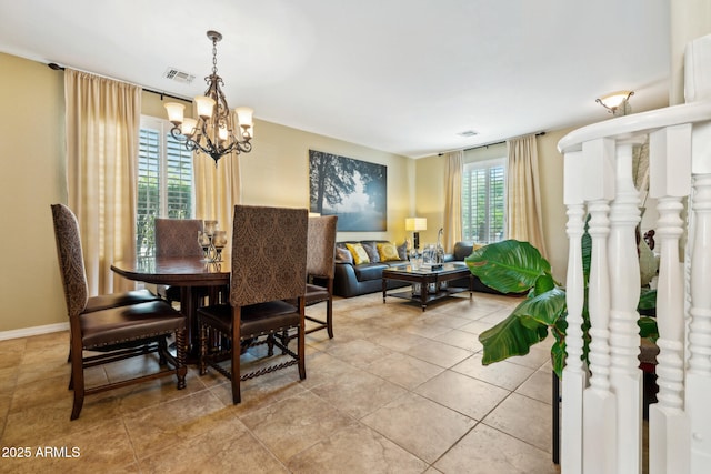 dining space featuring an inviting chandelier, light tile patterned floors, and visible vents