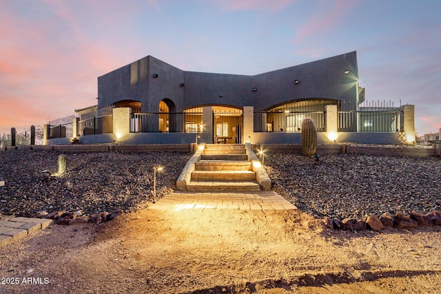 view of front of house featuring stucco siding