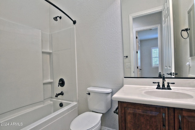 full bathroom featuring bathing tub / shower combination, toilet, and vanity with extensive cabinet space