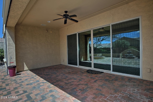 view of patio featuring ceiling fan