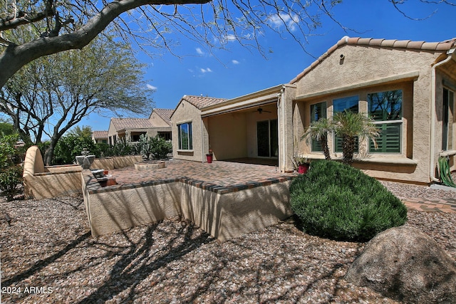 back of house featuring a patio area