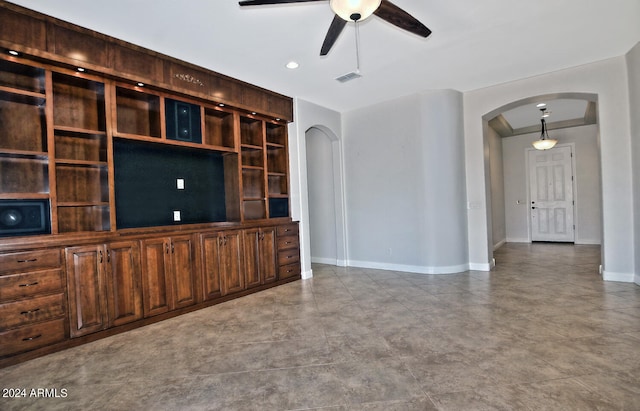 unfurnished living room with ceiling fan and light tile floors