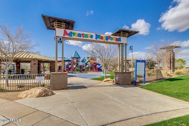 exterior space with a playground and a lawn