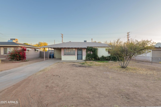 view of front facade with a carport