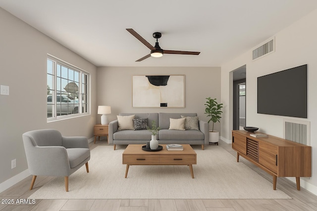1010 W 5th Pl, Mesa, AZ 85201 - living room with ceiling fan, baseboards, and light wood-style floors