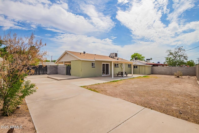 1010 W 5th Pl, Mesa, AZ 85201 - rear view of house featuring driveway, a patio area, and a fenced backyard