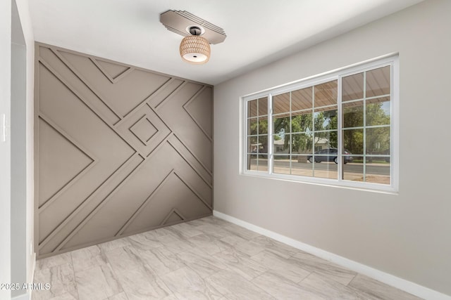 1010 W 5th Pl, Mesa, AZ 85201 - spare room featuring baseboards and light marble finish floors