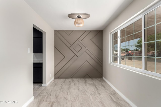 1010 W 5th Pl, Mesa, AZ 85201 - empty room with baseboards and light marble finish floors
