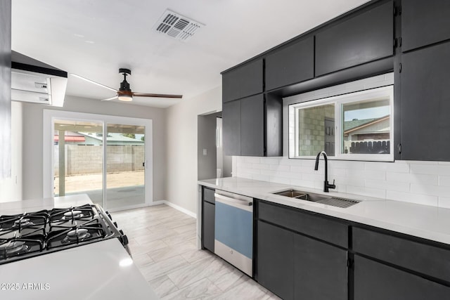 1010 W 5th Pl, Mesa, AZ 85201 - kitchen featuring dishwasher, a sink, light countertops, and decorative backsplash