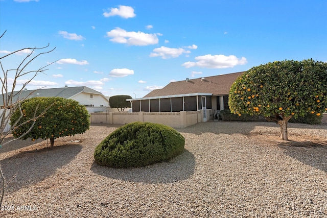 view of yard featuring a sunroom