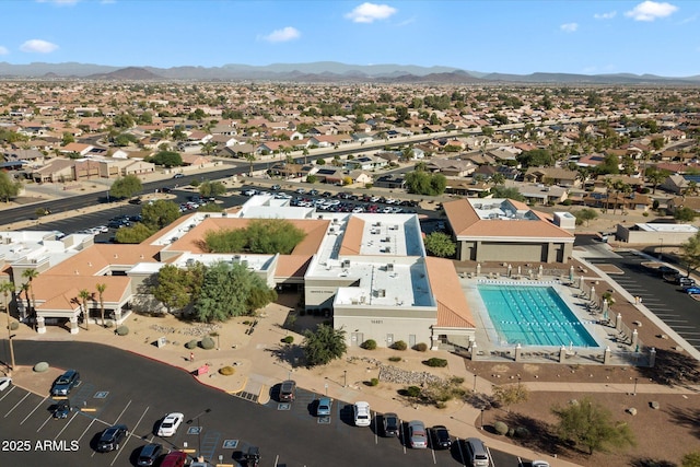 birds eye view of property with a mountain view