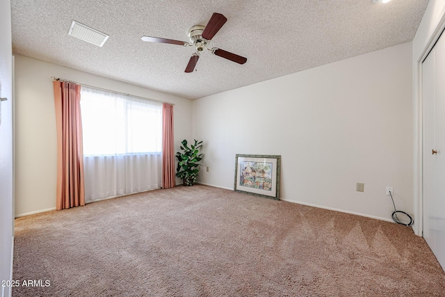 10326 W Pleasant Valley Rd, Sun City, AZ 85351 - unfurnished room with a textured ceiling, carpet flooring, visible vents, and a ceiling fan