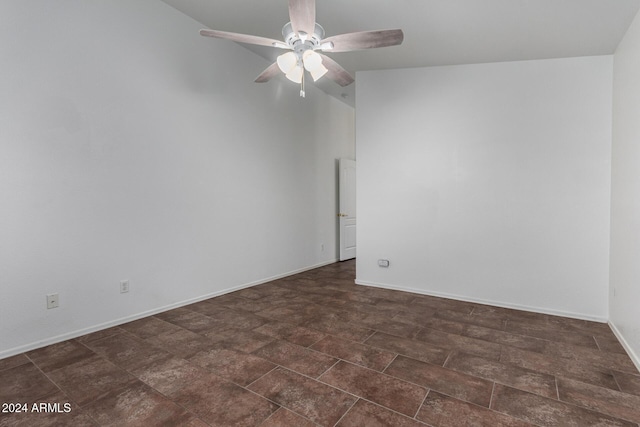 unfurnished room featuring vaulted ceiling