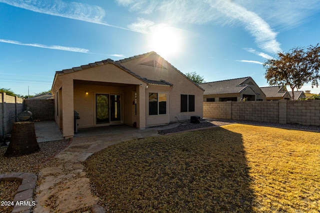 rear view of house with a lawn