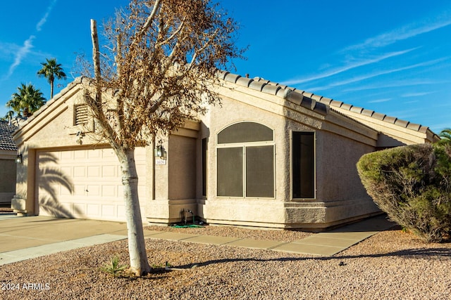 view of front of property with a garage