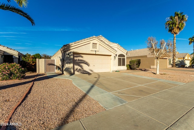 single story home with a garage