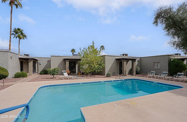 community pool featuring a patio area