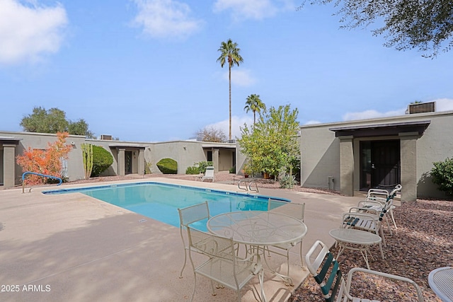 pool featuring a patio area