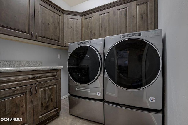 washroom with cabinets and separate washer and dryer