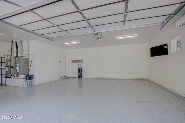 garage with a garage door opener, heating unit, and electric water heater