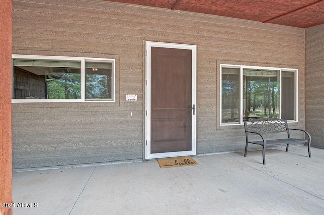 doorway to property featuring a patio area