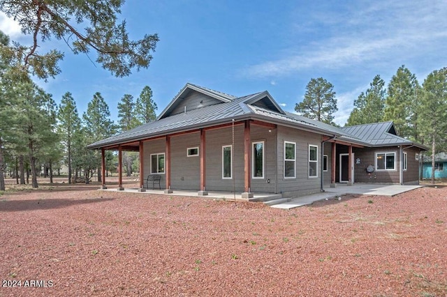 view of front of property featuring a patio