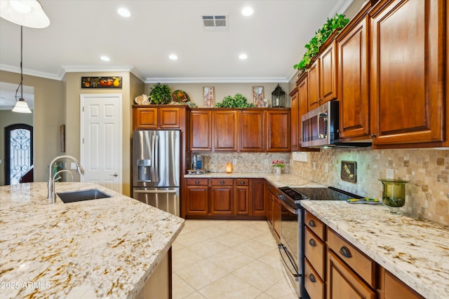 kitchen with decorative light fixtures, sink, ornamental molding, light stone counters, and appliances with stainless steel finishes