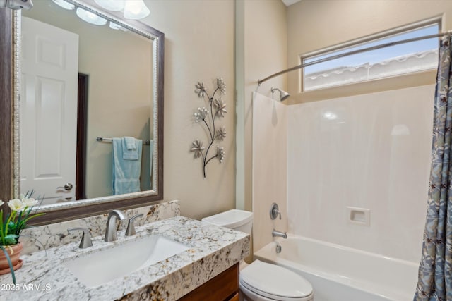 full bathroom featuring toilet, vanity, and shower / bathtub combination with curtain